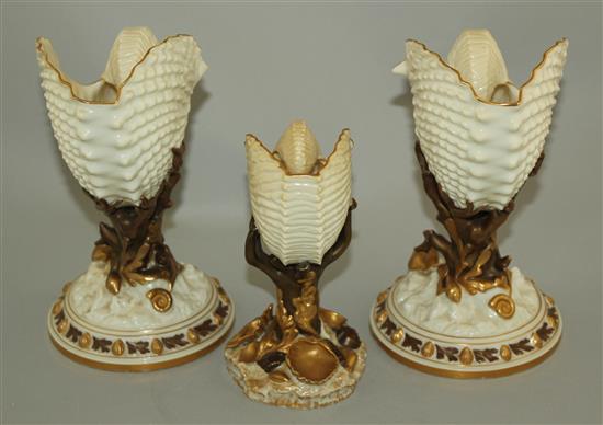 Three Royal Worcester nautilus shell vases, late 19th century, 22cm and 17.5cm